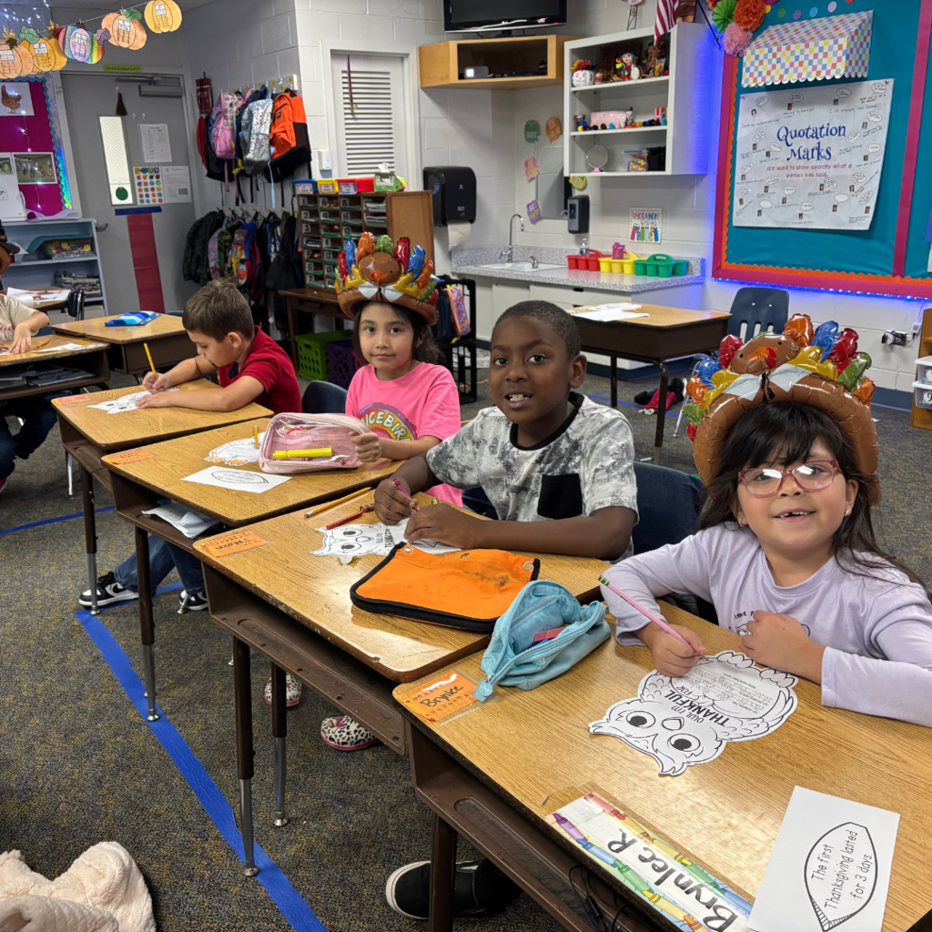 kids at desk working on their projects