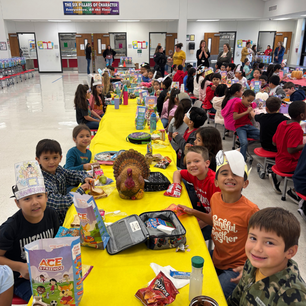 kids at cafeteria table covered with a tablecloth