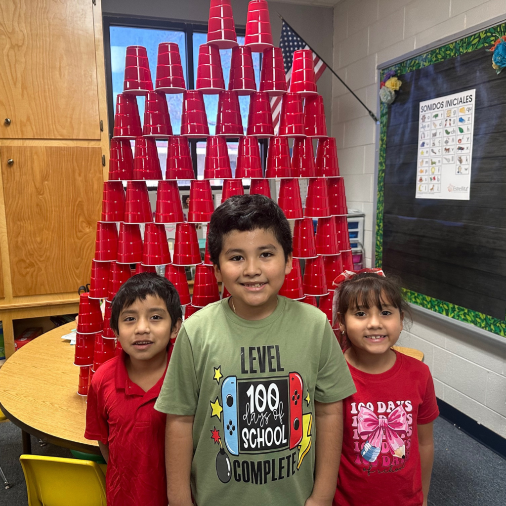 kids with a stack of 100 cups