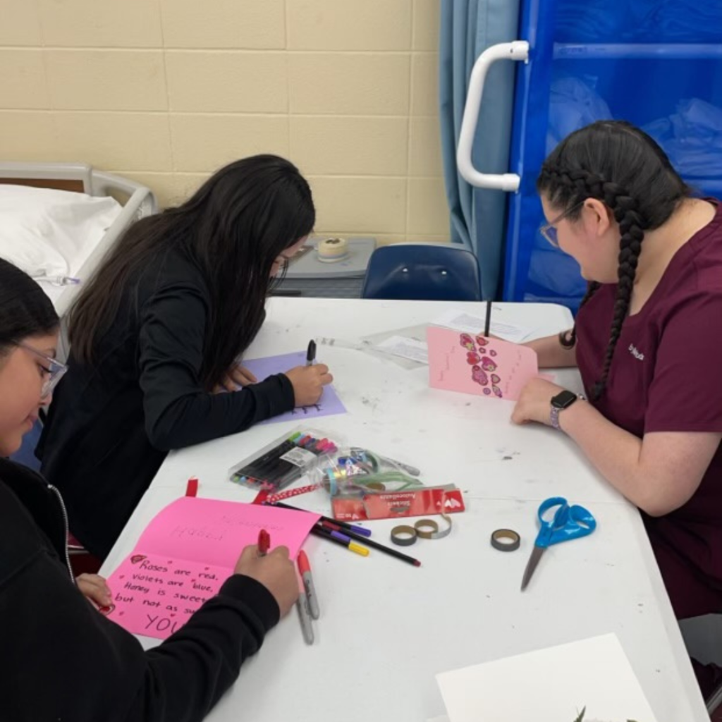 people at table making cards