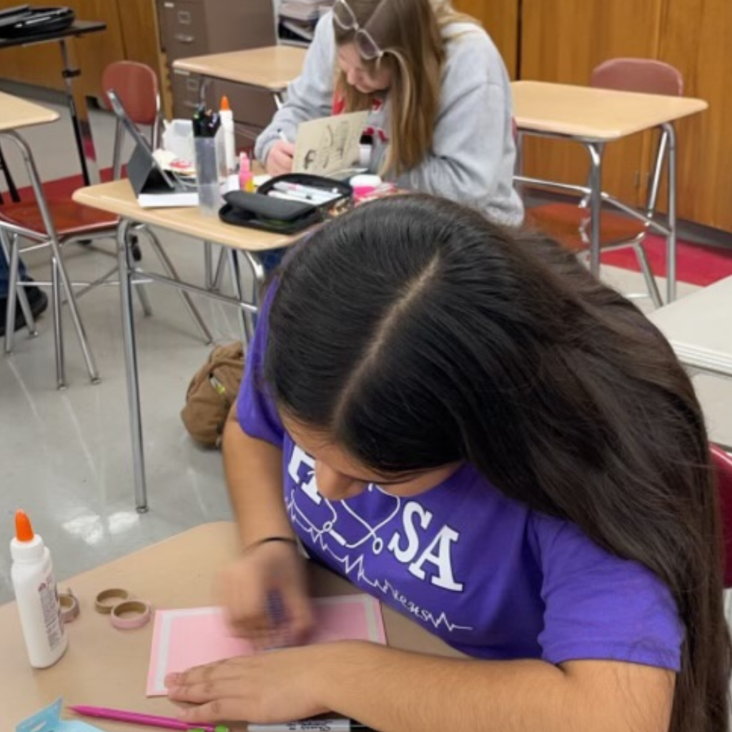 people at table making cards