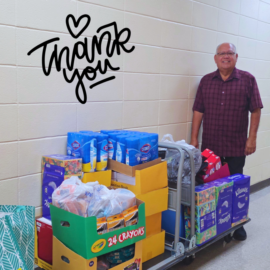 MAN WITH CART OF SUPPLY DONATION