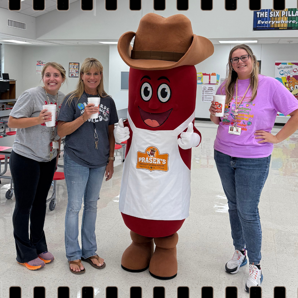 prasek's mascot with teachers and tea