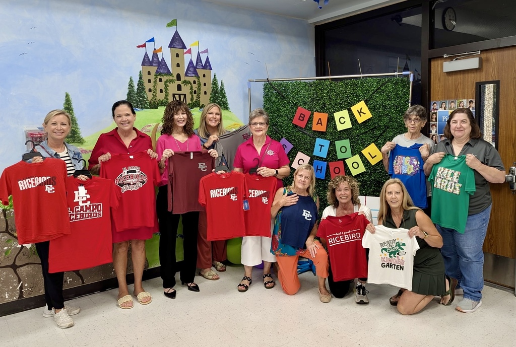 group of women holding spirit shirts with Myatt administrators