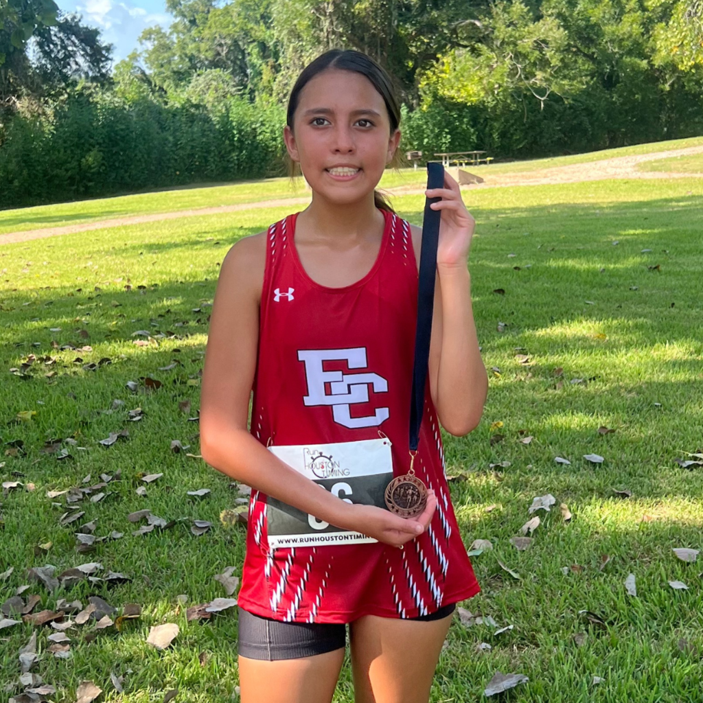 girl with medal at the meet