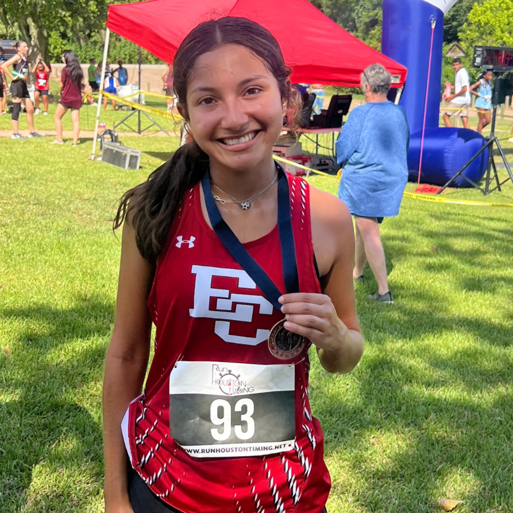 girl with medal at the meet