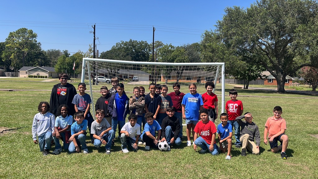 group of kids by soccer goal