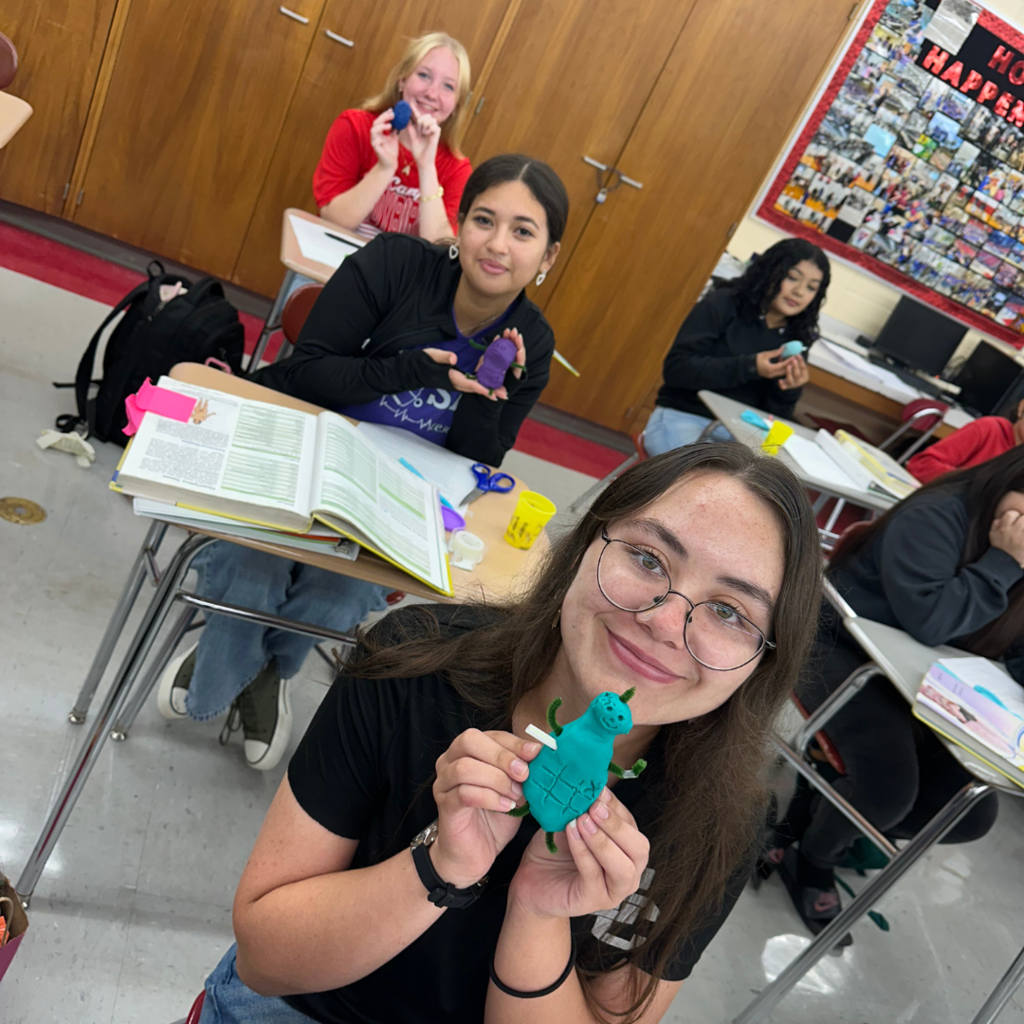 students showing off their potato