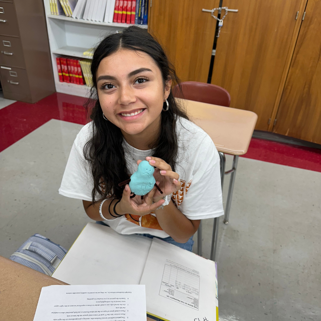 student showing off her potato