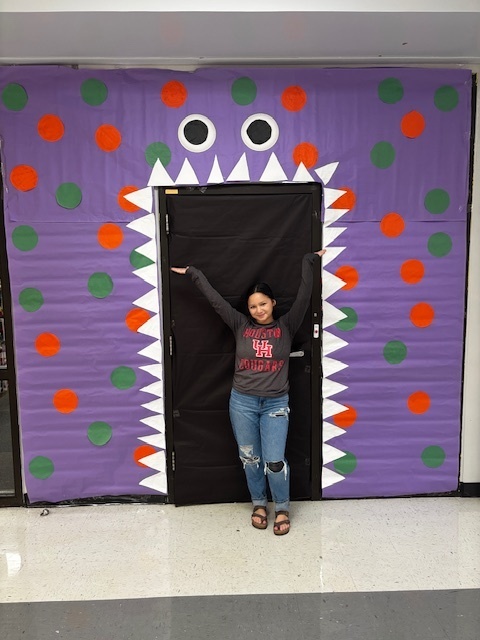 girl in front of monster door