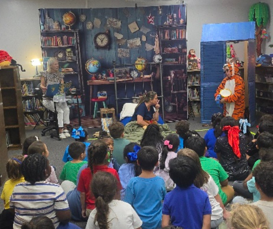 3 adults in character performing for children