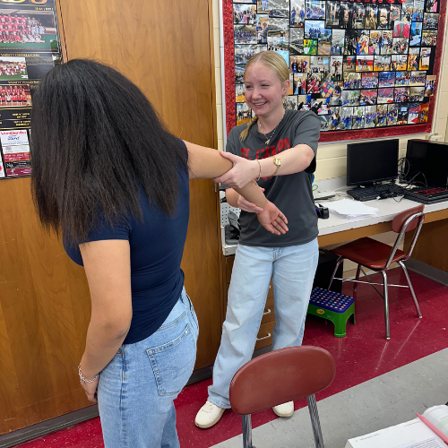 student working on range of motion with their student patient