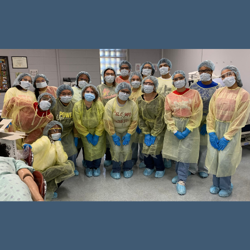 students dressed in PPE