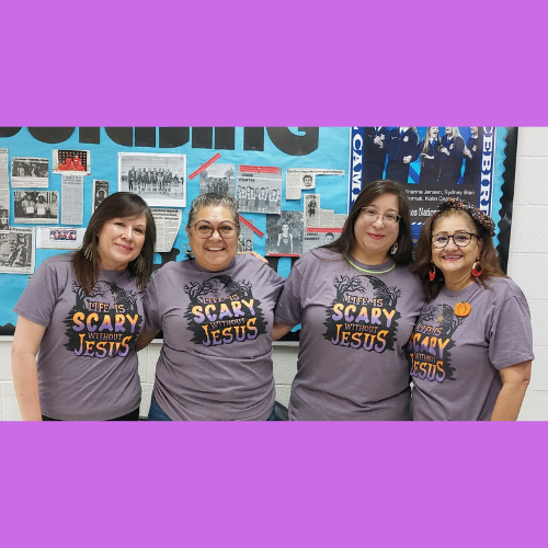 4 ladies in halloween shirts