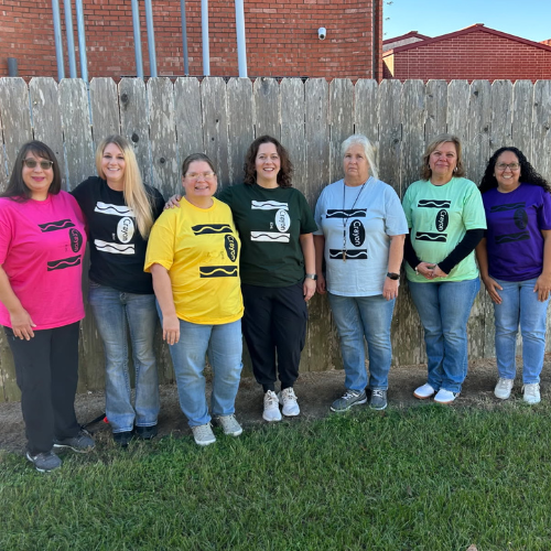 adults in different colored crayon shirts