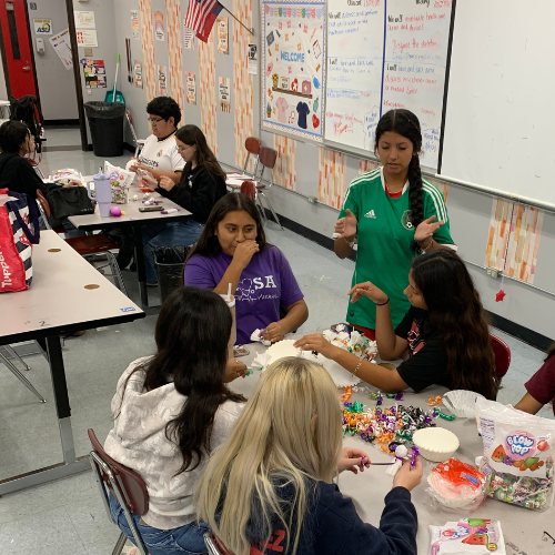 kids at tables with candy and bags