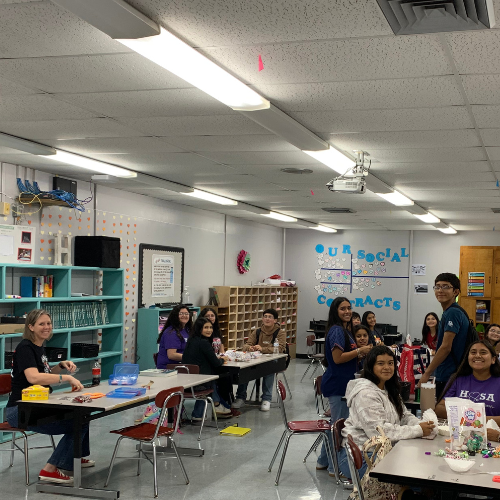 kids at tables with candy and bags