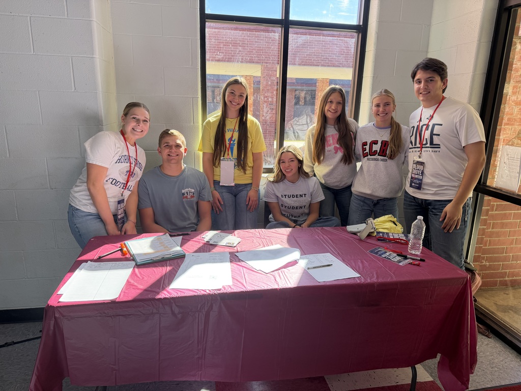 students at sign in table