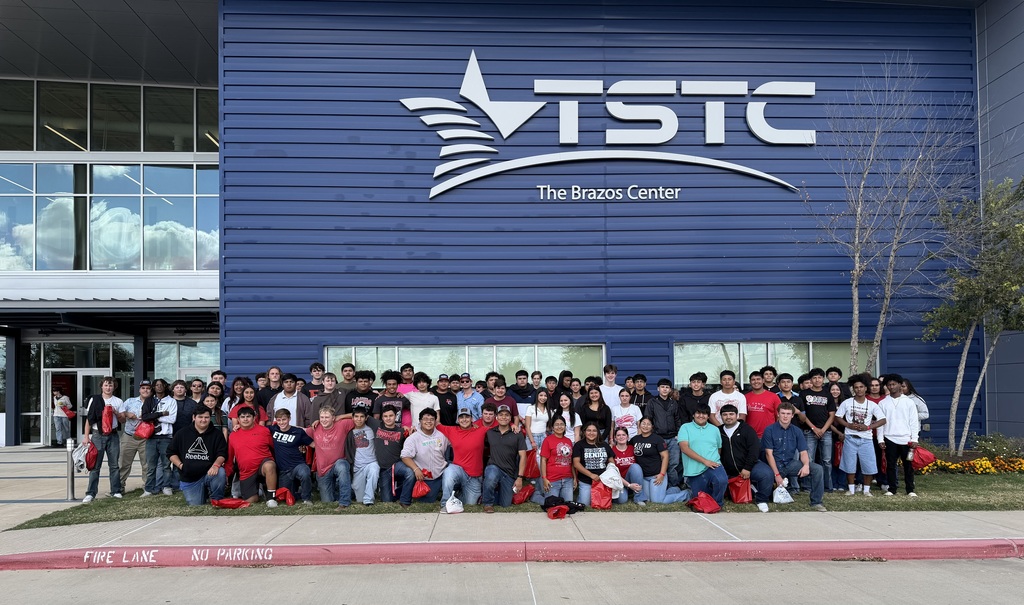 group picture by TSTC sign