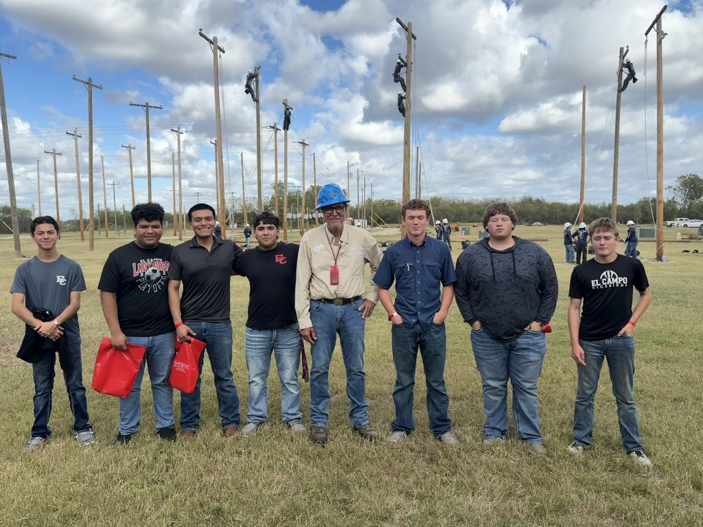 students with linework trainer in field of electrical poles