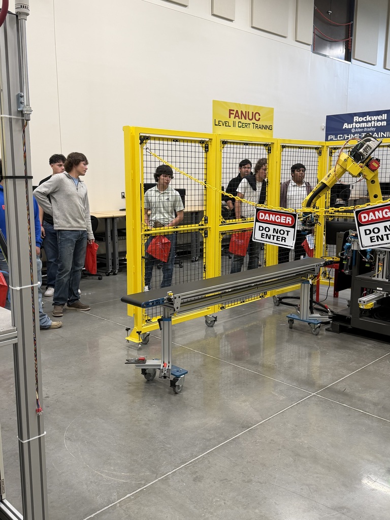 students looking at training equipment