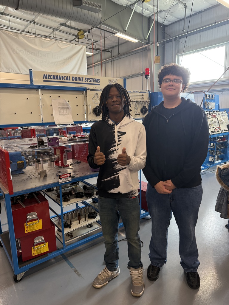 students looking at training equipment