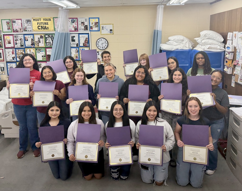 several students with their certificates