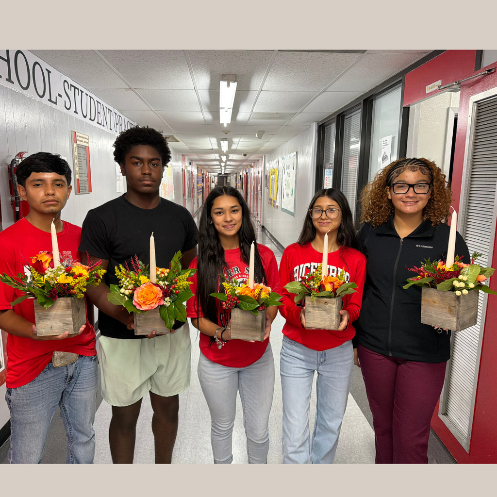 students holding their arrangement 