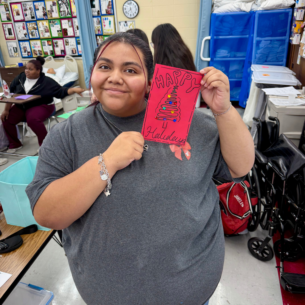 student showing her holiday card