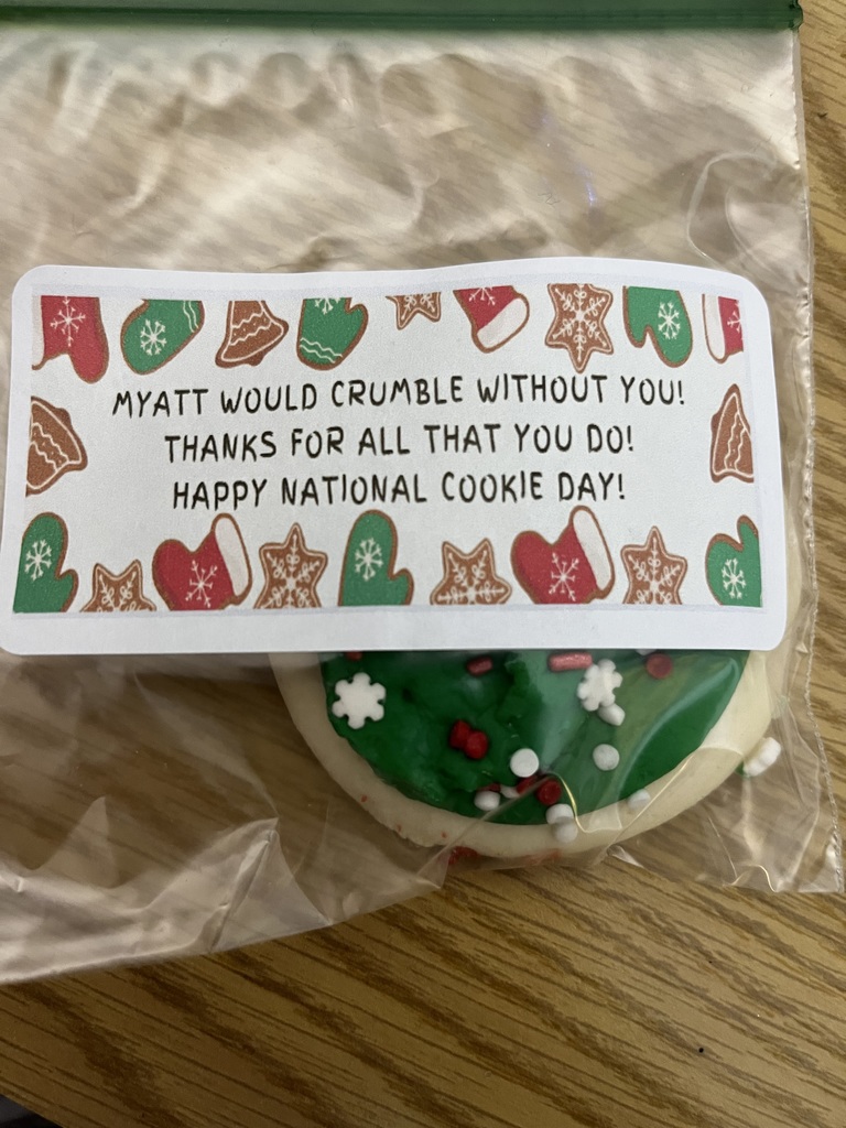 plastic bag with cookie and sticker that says myatt would crumble without you! thanks for all that you do! happy national cookie day!