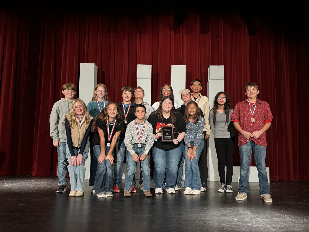 cast with awards on stage