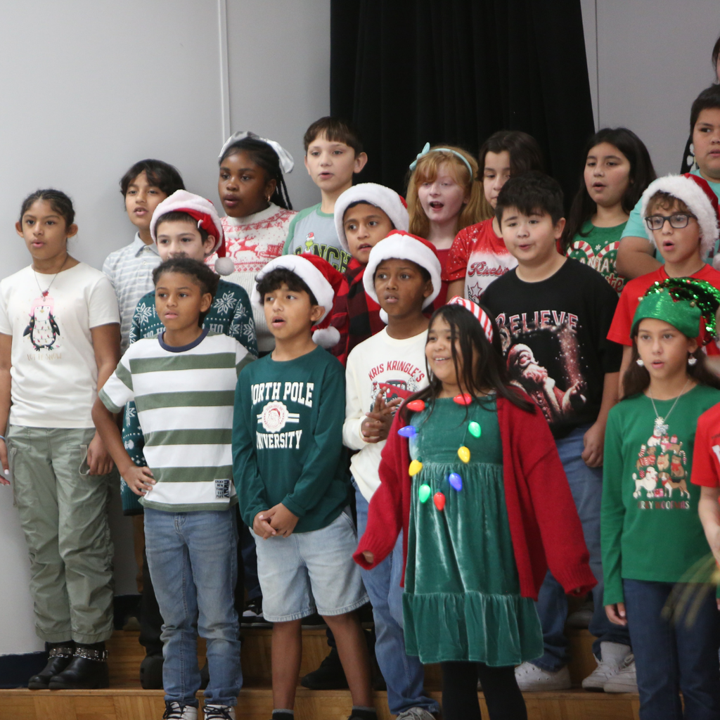 students singing at program