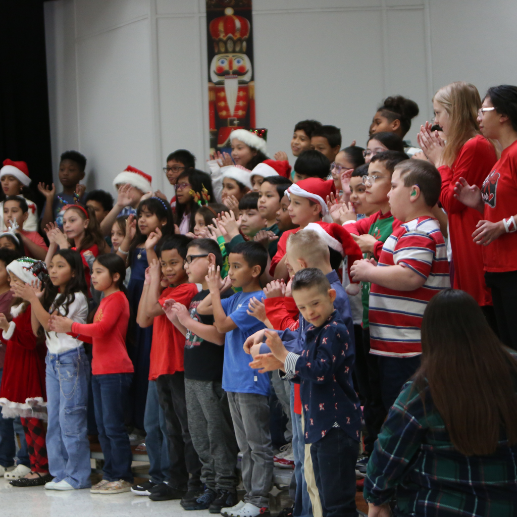 students singing at program