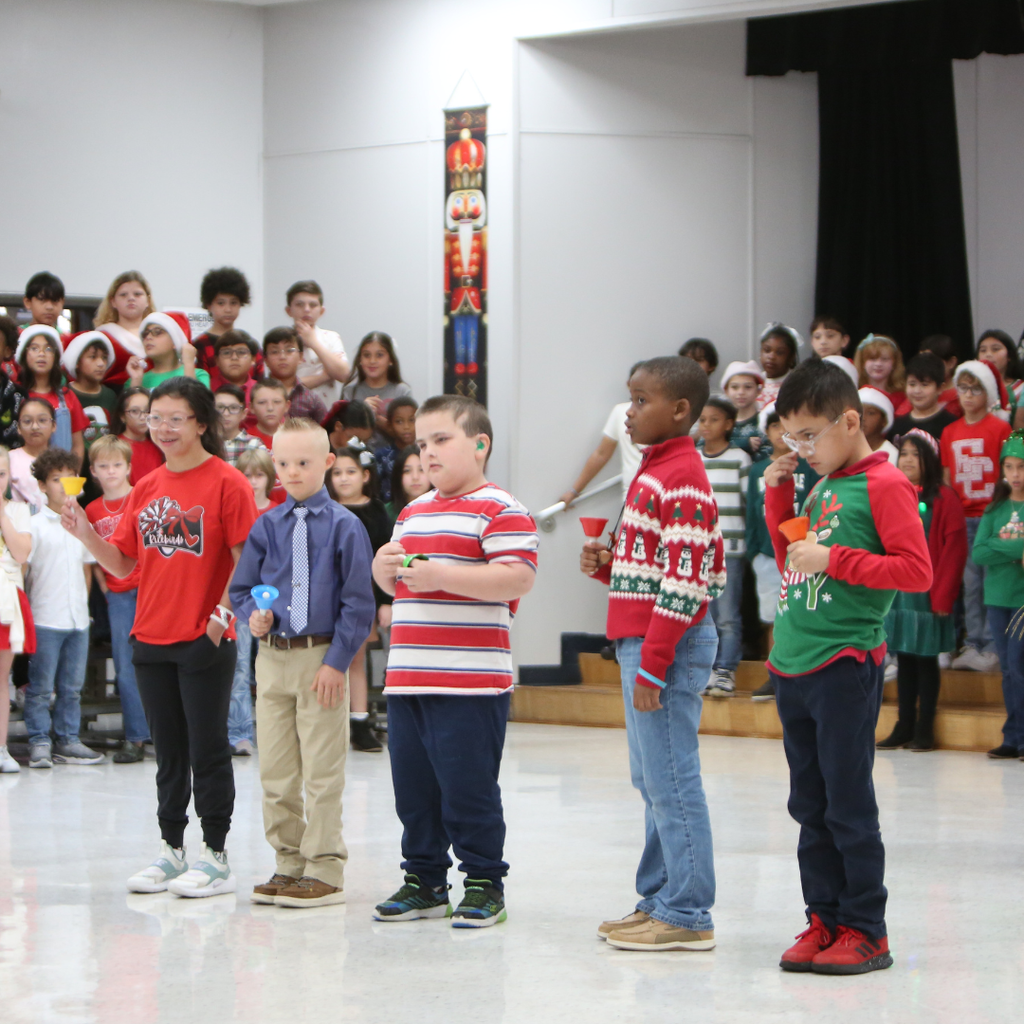 students performing with bells at program