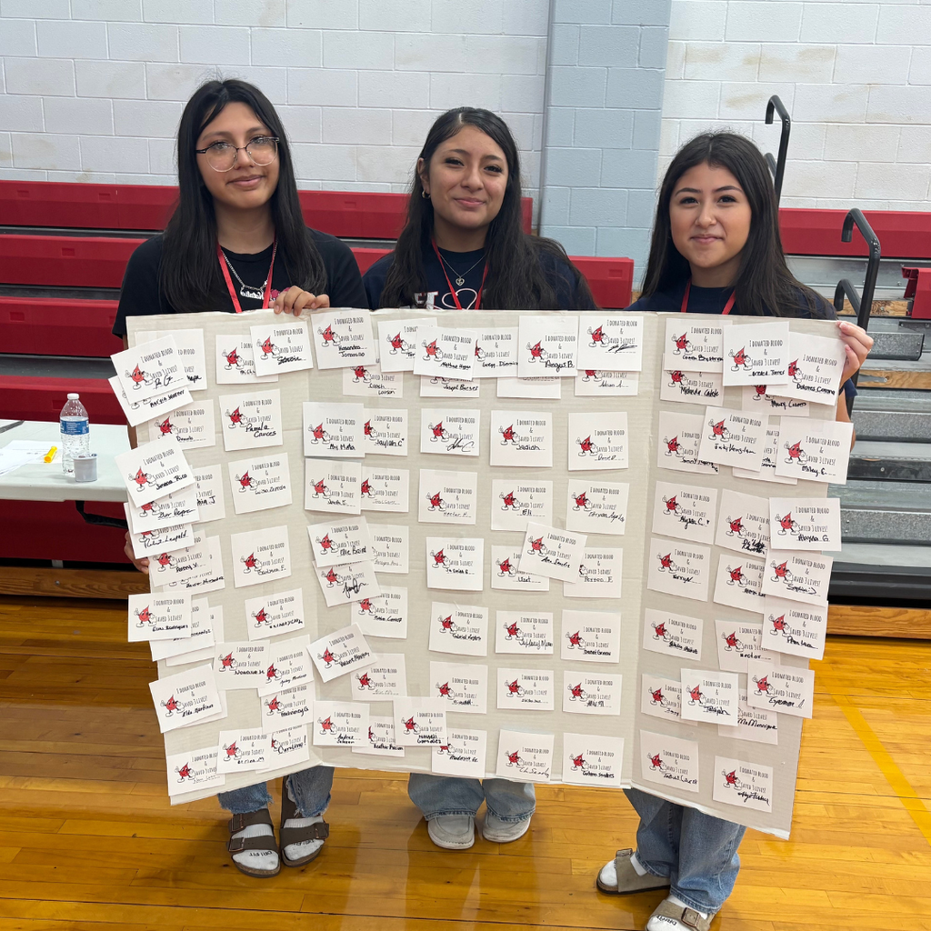 students with poster full of donation names