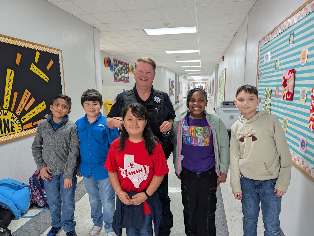 holder with 5 students at northside