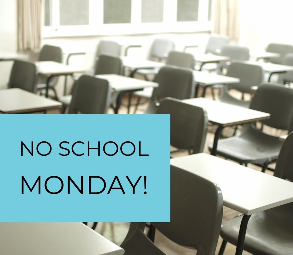 classroom of empty desks with a sign saying no school monday