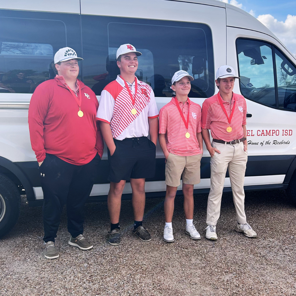 JV golf team wearing medals