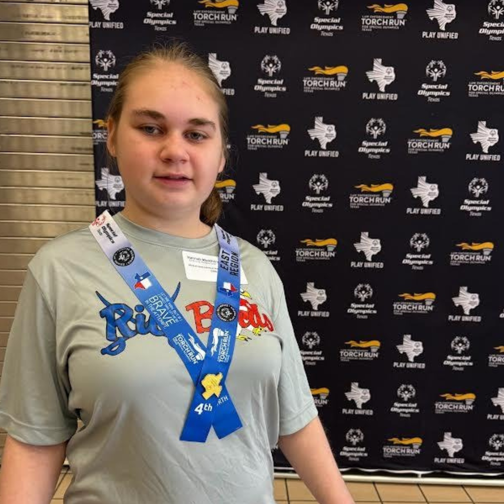 Hannah Weathers wearing a blue ribbon