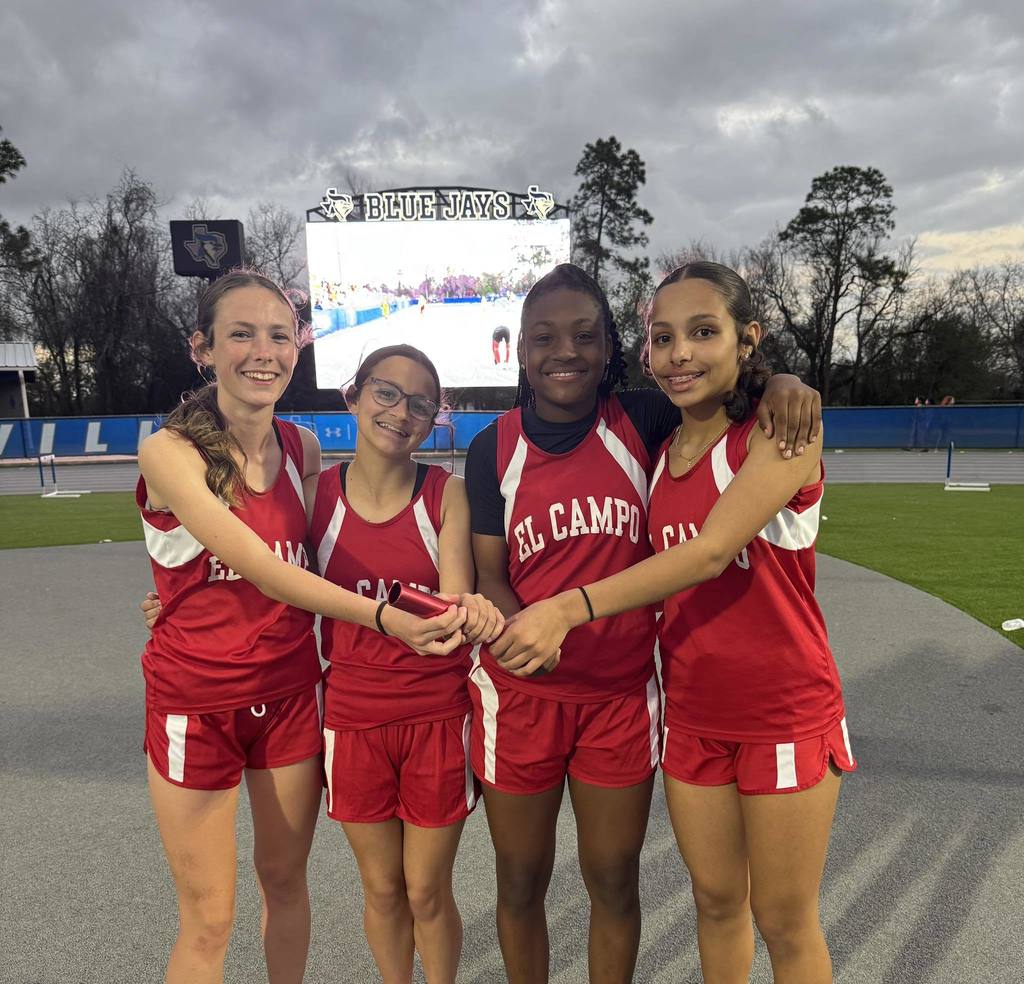 4 girls holding on to a baton 