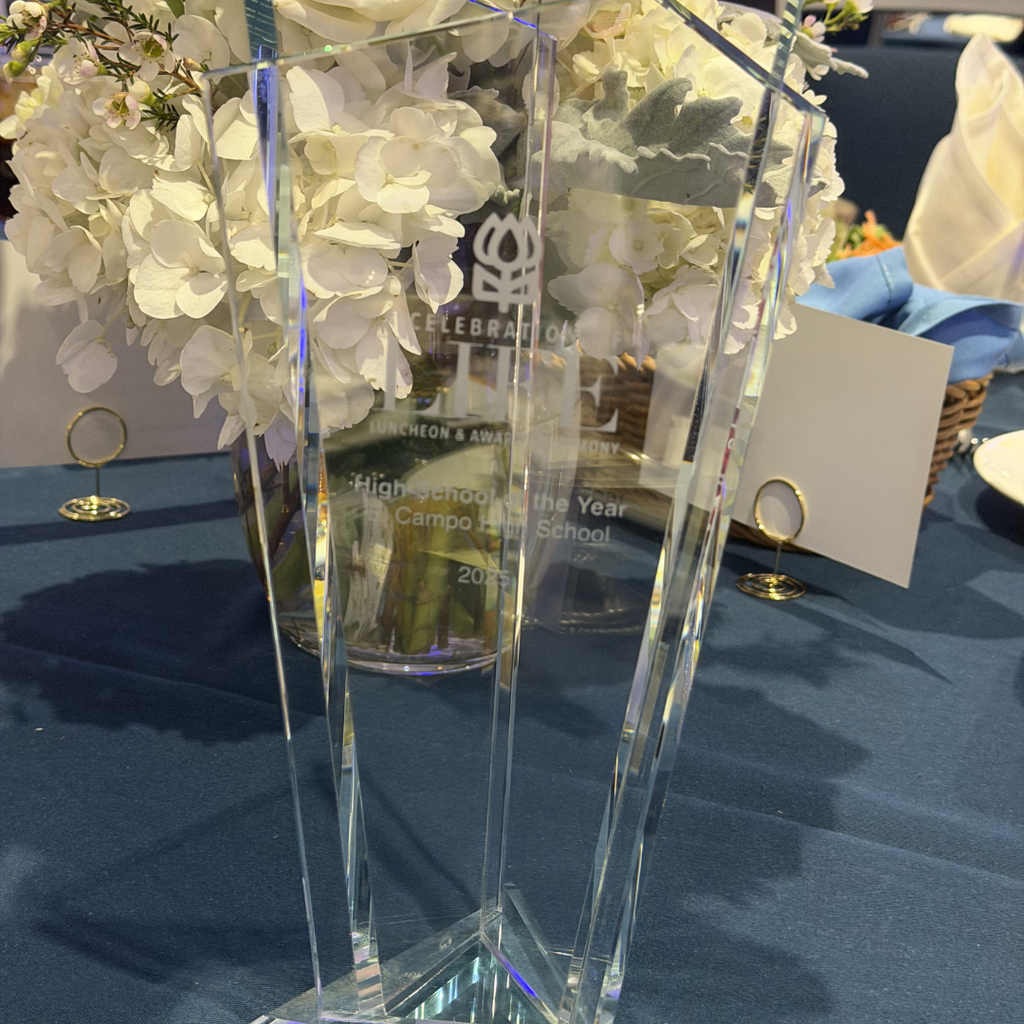 close up of the clear glass trophy with ECHS's name and 2025 etched into it 
