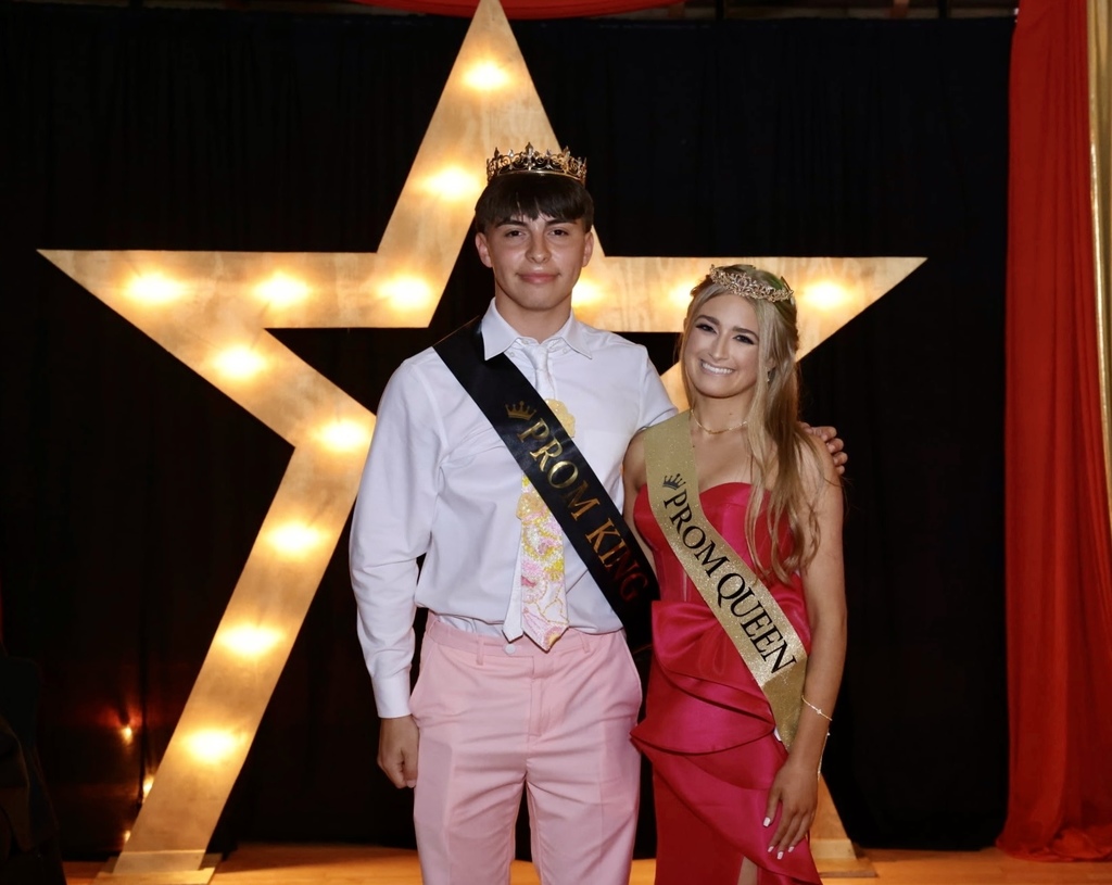 jeremy and layni in their banners and wearing their crowns