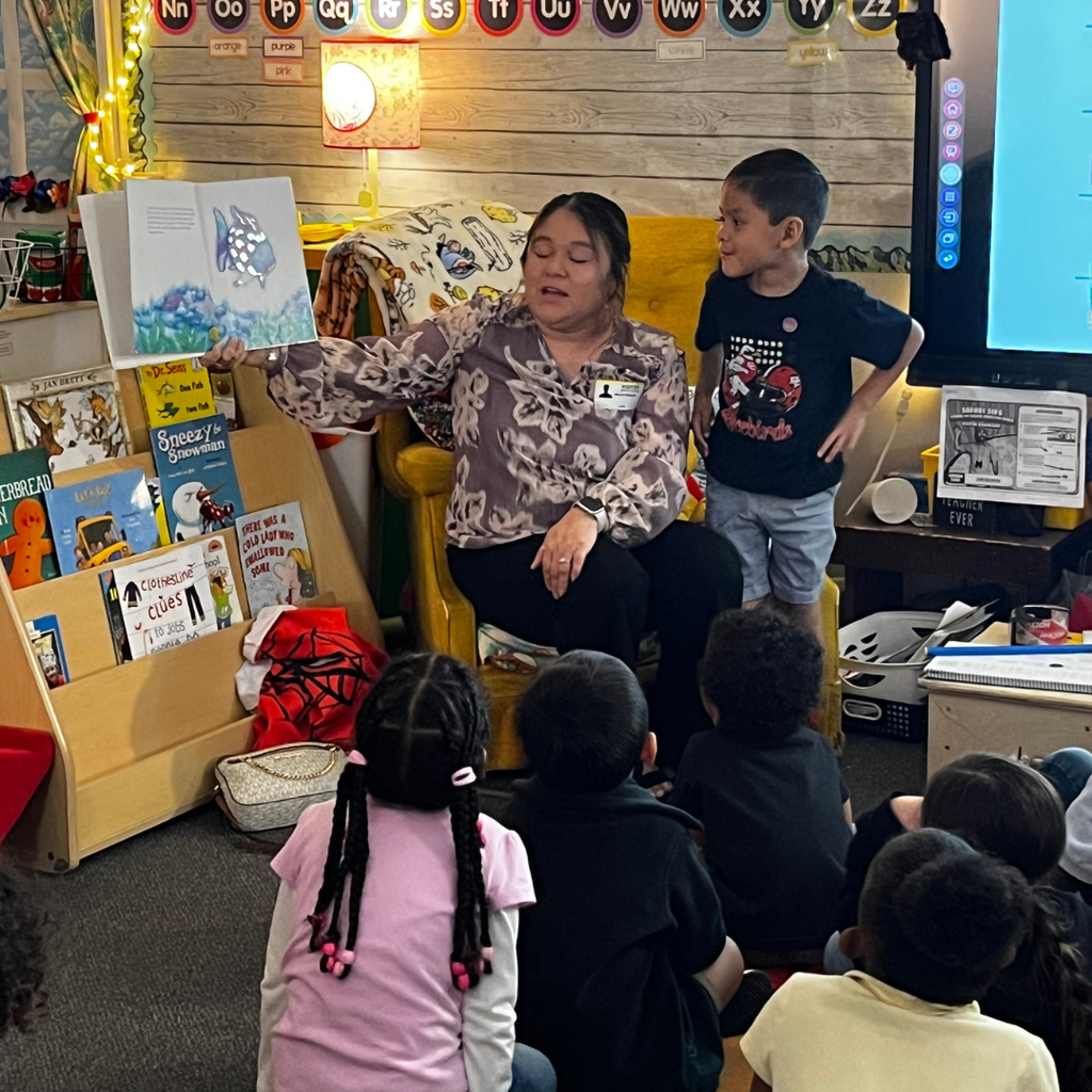 an adult woman and her son reading to students in classroom