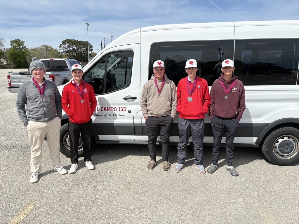 golf boys wearing their medals