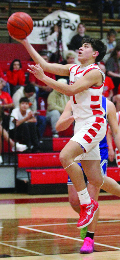 Nathan going up to make a basket