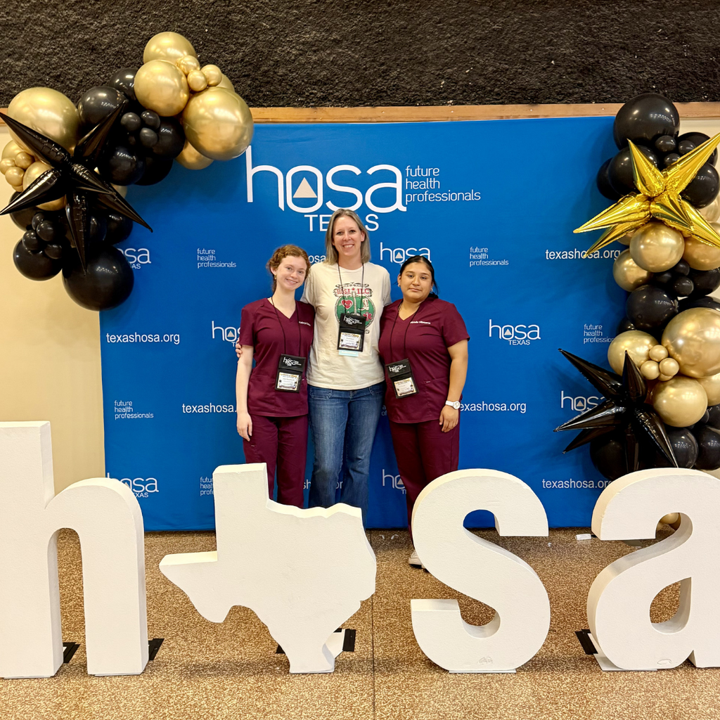 Kacer with Kate and Michelle by HOSA backdrop