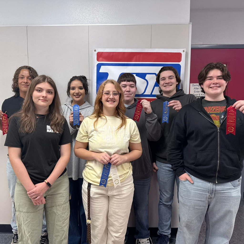 7 students holding their ribbons from the event