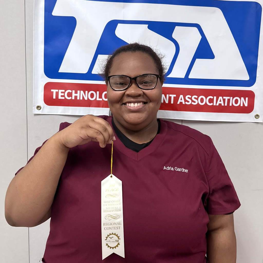 Adria Gardner holding white ribbon