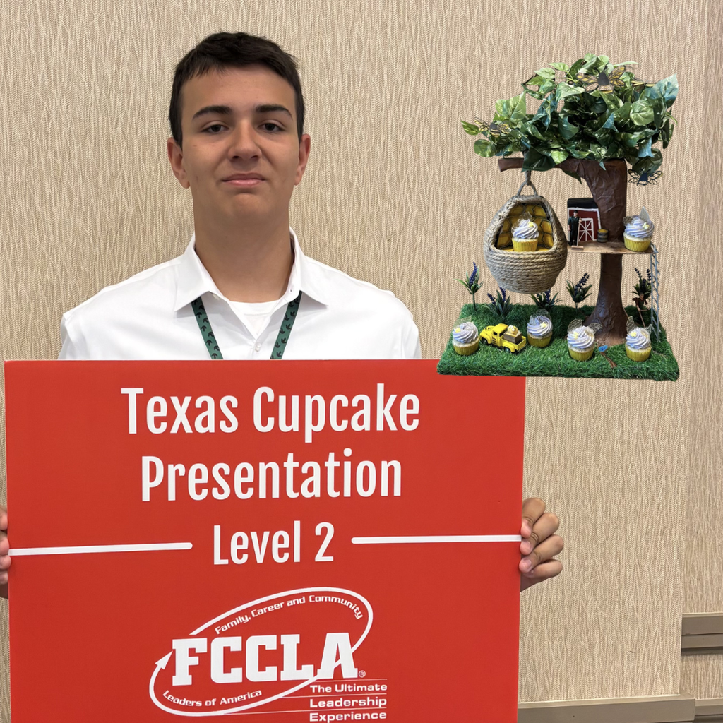 Wishert holds a red sign that says "Texas Cupcake Presentation Level 2" with the FCCLA logo. Several cupcakes are on display on a tray behind the right.