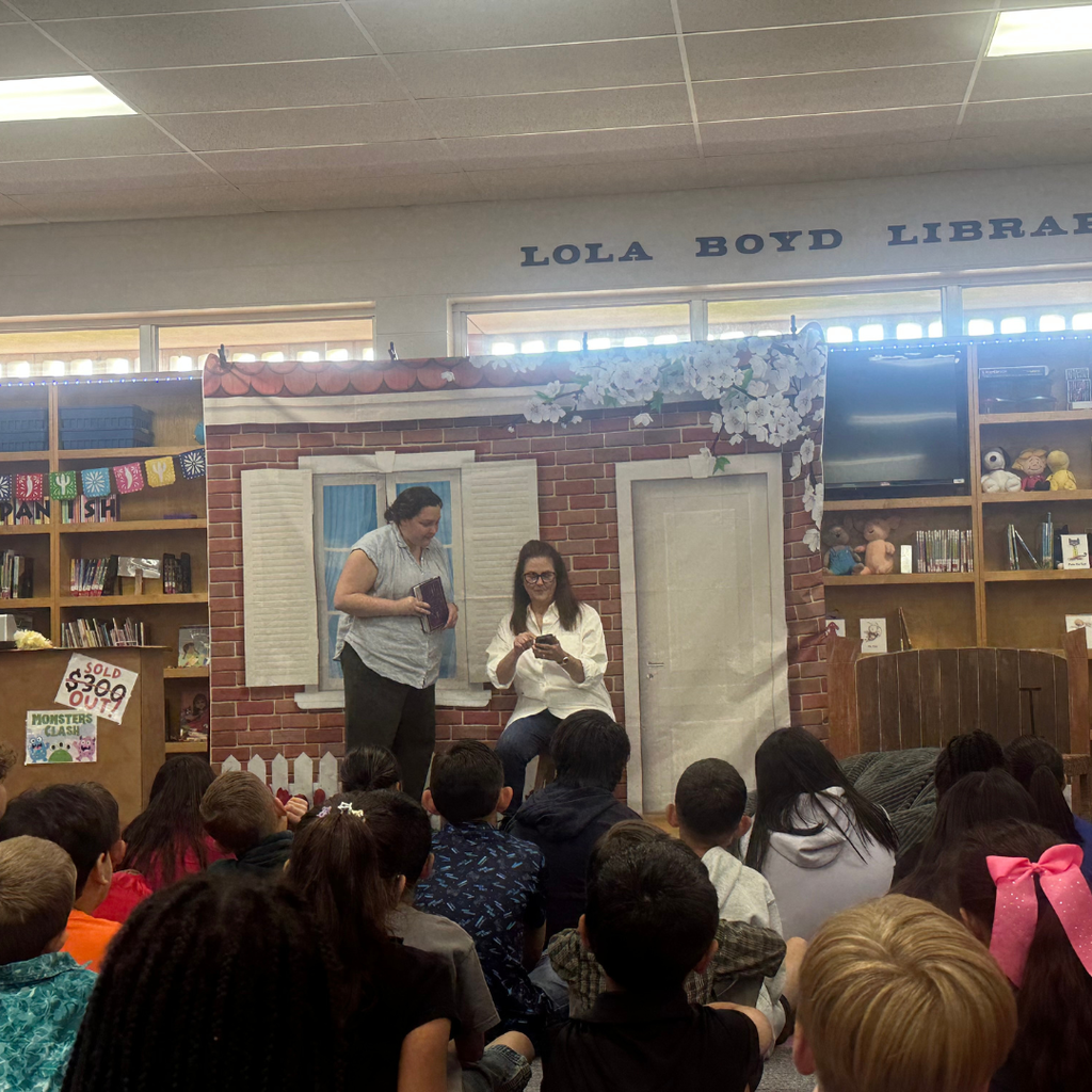 2 ladies acting out the book being read to the students